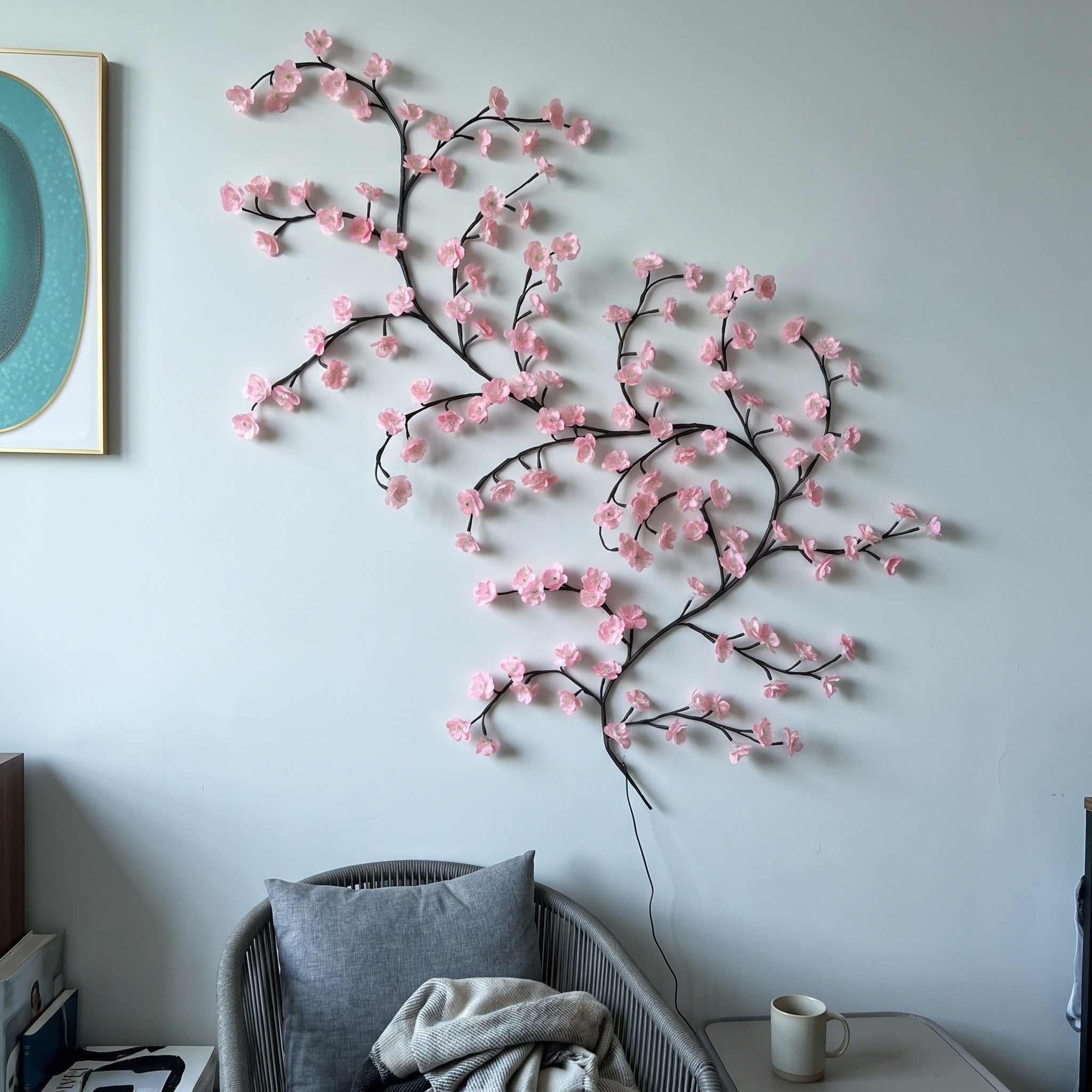 Unlit pink blossom vine in a living room next morning